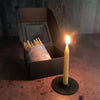 box of 20, 20-minute candles with one lit