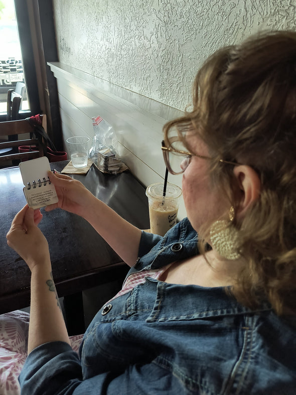 reading a Scripture Flip in a coffee shop