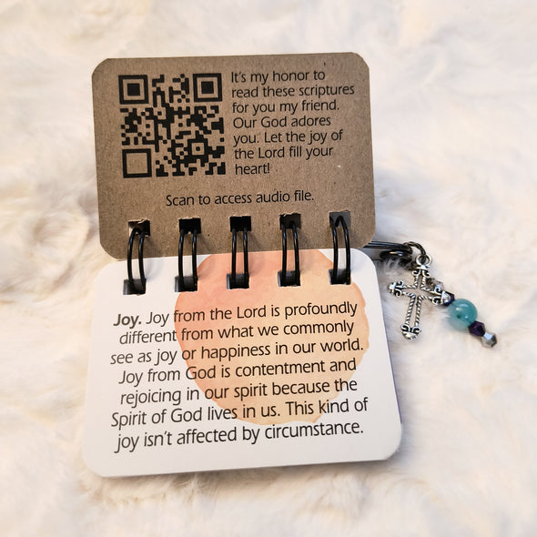 The Joy Flip has a QR code inside the front cover. Scan the code and listen to beautiful music and scriptures being read over you. It is a truly special experience.